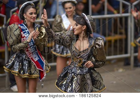 ORURO, BOLIVIA - FEBRUARY 26, 2017: Caporales dancer in ornate costumes performing as they parade through the mining city of Oruro on the Altiplano of Bolivia during the annual carnival.