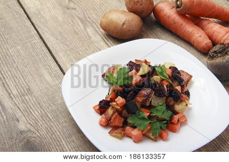 Salad baked beetroot fresh carrots and potatoes. Healthy food from organic products