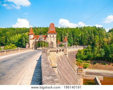 Fairytale dam Les Kralovstvi with picturesque towers on sunny summer day, Czech Republic.
