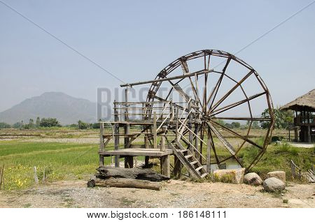 Big Wooden Turbine Baler Water Wheel At Thai Dam Cultural Village In Chiang Khan At Loei, Thailand