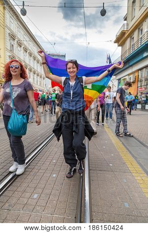 ZAGREB, CROATIA - JUNE 11, 2016: 15th Zagreb pride. LGBTIQ activist holding flag.
