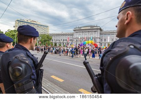 ZAGREB, CROATIA - JUNE 11, 2016: 15th Zagreb pride. Intervention policemen in front of Mimara museum securing LGBTIQ activists and supporters during the gay pride.