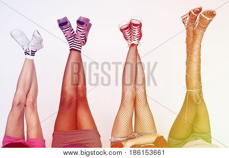 Woman laying back down and putting legs up high