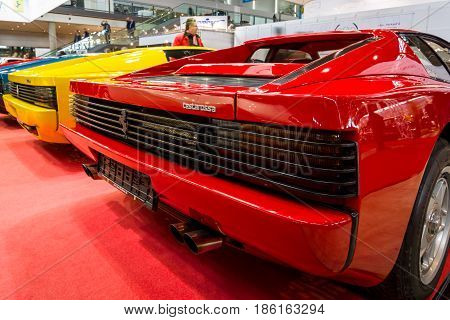 STUTTGART GERMANY - MARCH 02 2017: Rear view of various modifications of sports cars Ferrari Testarossa and F512. Europe's greatest classic car exhibition 