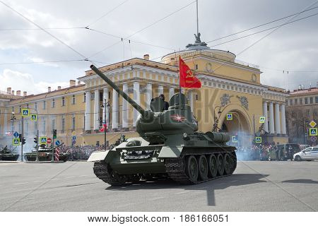 ST PETERSBURG, RUSSIA - MAY 09, 2017: Soviet tank of the Great Patriotic War T-34-85 against the background of the Admiralty building. Fragment of the parade in honor of Victory Day