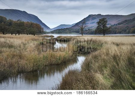 Stuning Autumn Fall Landscape Image Of Lake Buttermere In Lake District England