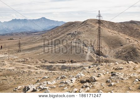 Power line in the mountains. Nurata ridge Uzbekistan