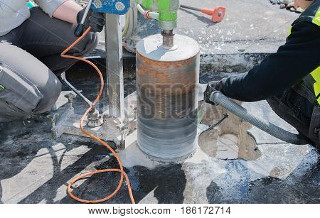 Core drilling for ventilation through a building ceiling