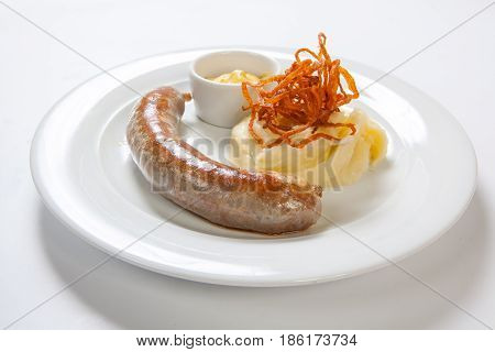 Mashed Potato And Roasted Sausage Or Bratwurst On White Plate