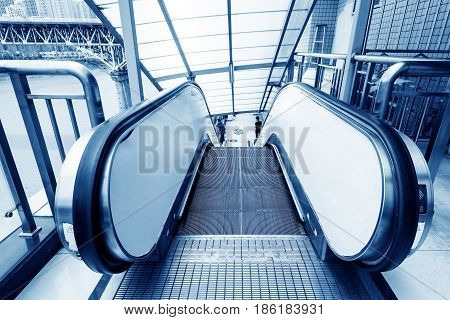 Hall stairs and escalators modern building interior.