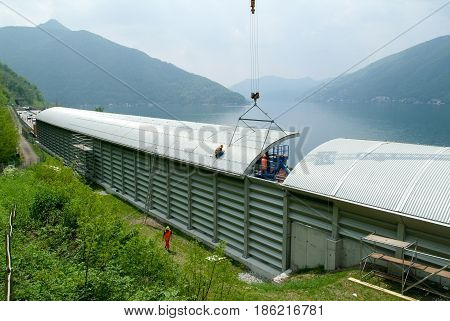 Workers During The Installation Of Noise Barriers On The Highway