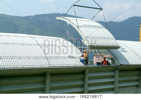 Workers During The Installation Of Noise Barriers On The Highway