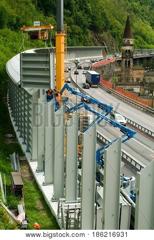 Workers During The Installation Of Noise Barriers On The Highway