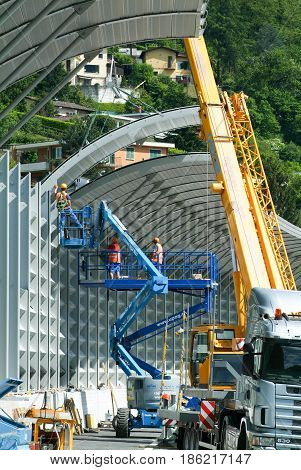Workers During The Installation Of Noise Barriers On The Highway
