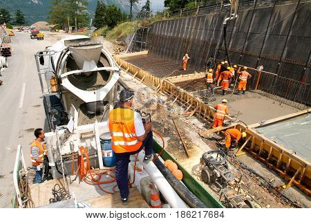 Truck Operator Pouring Cement With A Pump