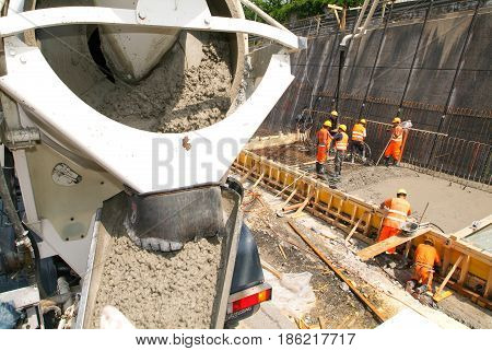 Truck Operator Pouring Cement With A Pump
