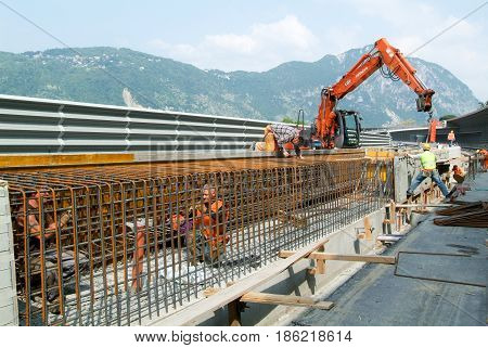 Worker Tying Rebar For Construction Of A Highway