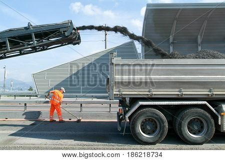 Workers And Vehicles During The Road Milling Of The Highway