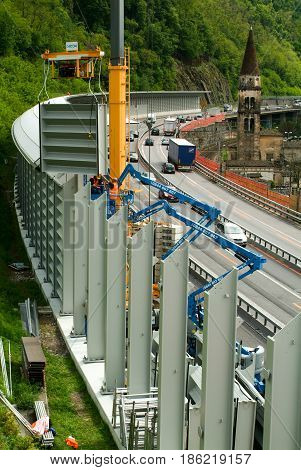 Workers During The Installation Of Noise Barriers On The Highway
