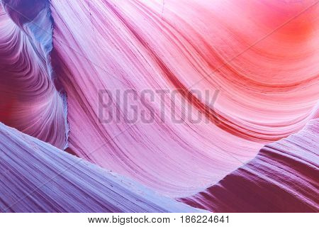 Abstract multi-color swirling pattern and color transitions in the limestone formations underground Lower Antelope Canyon Page Arizona USA
