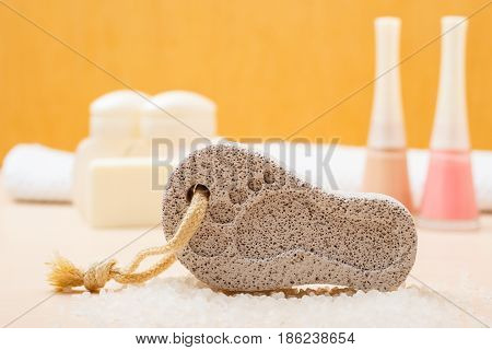 Feet nails care. Pedicure accessories set tools: soap varnish and stone pumice with foot print