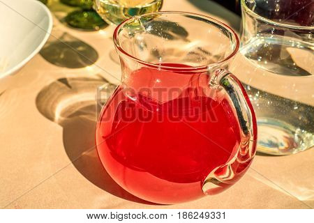 Traditional Russian drink mors made of berry and fruit smoothie in jar