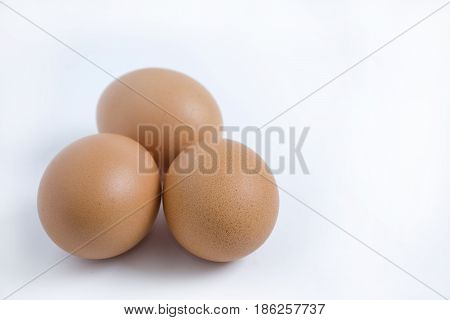 Three eggs isolated from the white background.