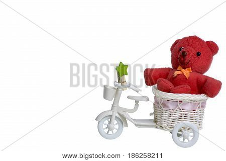 red teddy bear holding present on bicycle in white background love concept for valentines day