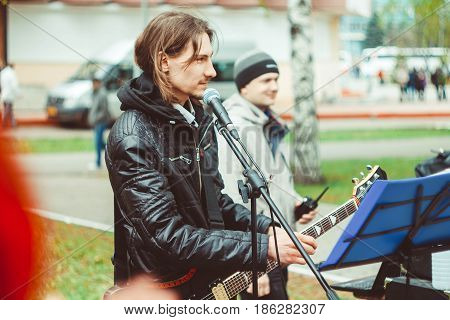 Russia Siberia Novokuznetsk - may 9 2017: musicians sing songs on the street on victory day