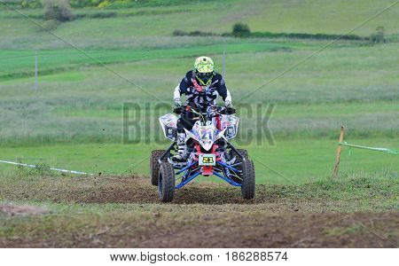 Unidentified Racer Rides A Quad Motorbike.