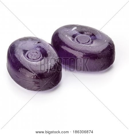Two colorful fruit hard sugar candies,  boiled sweeties or sugar plums isolated on white background cutout