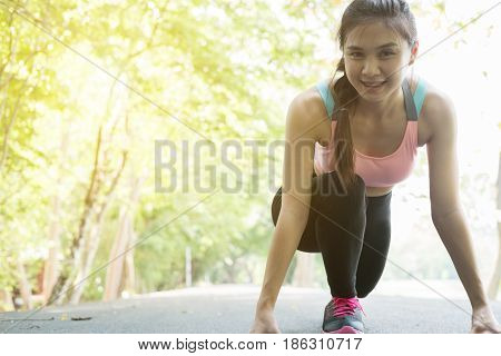 Sportswoman Athletic On Starting Point And Ready For Competition. Healthy Young Asian Athlete Woman