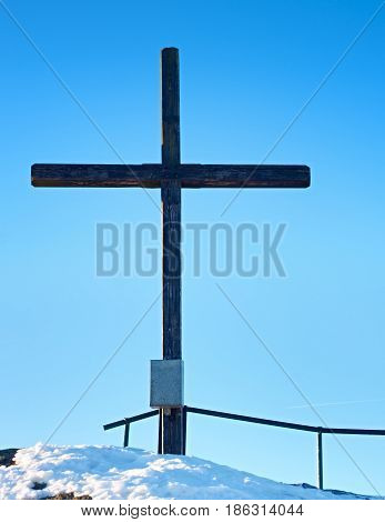 Sharp Summit  With Modest Cross Raised  On Mountain Peak.