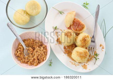 Dumpling with plum and buttered bread crumbs