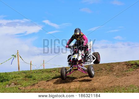 Unidentified Racer Rides A Quad Motorbike.