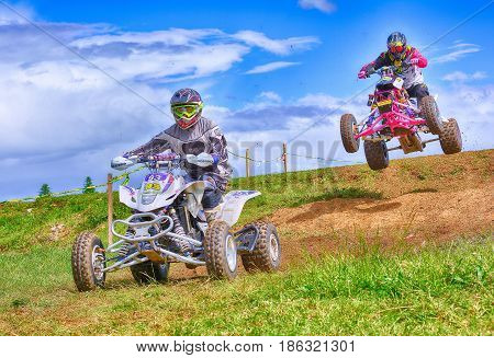 Unidentified Racers Rides A Quad Motorbike.