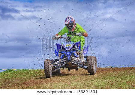 Unidentified Racer Rides A Quad Motorbike.