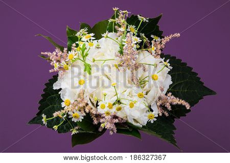 White romantic bunch of flowers White bouquet with hortensie and daisy flowers