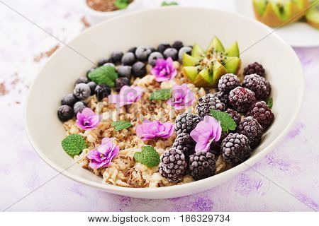Tasty And Healthy Oatmeal Porridge With Fruit, Berry And Flax Seeds. Healthy Breakfast. Fitness Food
