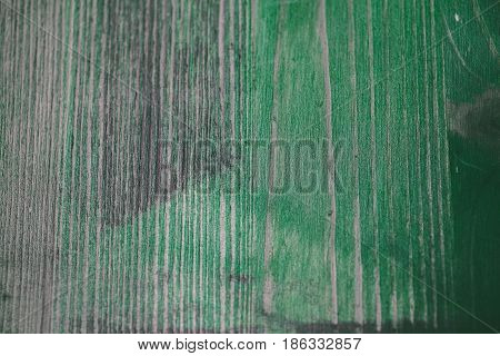 Green wood texture. Green wood background. Close up view of green wood texture and background. Abstract background and texture for designers. Rustic table. Texture of handmade green table.