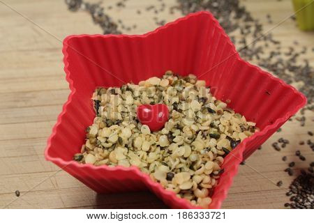 Hemp seeds/ This is a hemp seeds  in red star bowls.