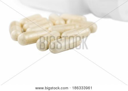 Capsules of glucosamine chondroitin healthy supplement pills and white container isolated on white background.