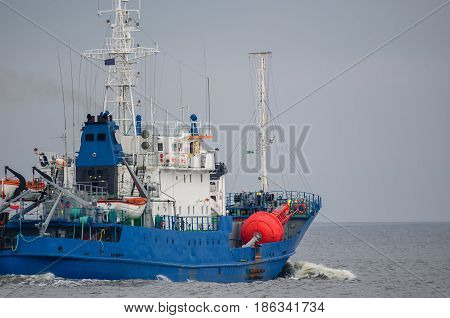 BUOY-LAYING VESSEL - The ship sails into the sea with a signaling buoy