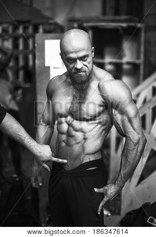 Bodybuilding Contest Behind The Scenes: The Contestant Is Preparing For The Performance. Selective F