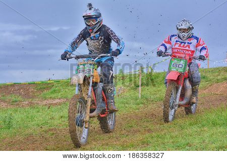 Unidentified Racers Rides A Classic Motorcycle.