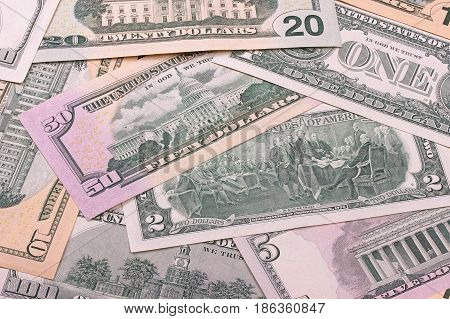 Abstract Dollar Bills Of Different Denominations Background.