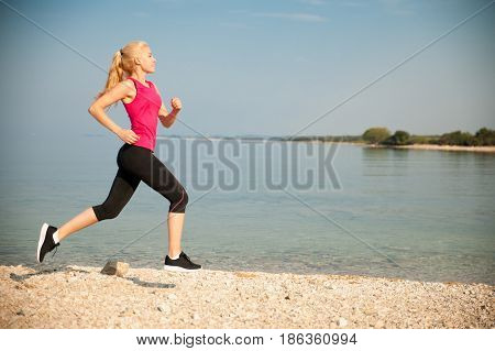 Jogging In Th Beach - Woman Runns Near Sea On Early Summer Morning