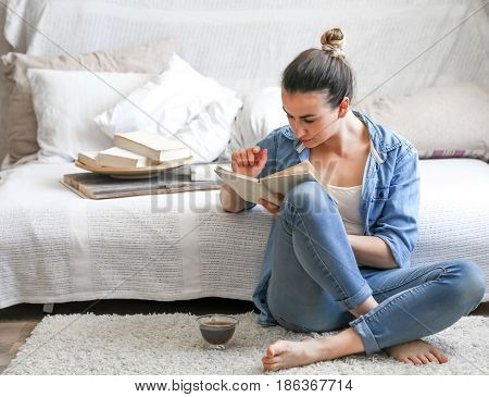 Girl Reading A Book In A Cozy Room