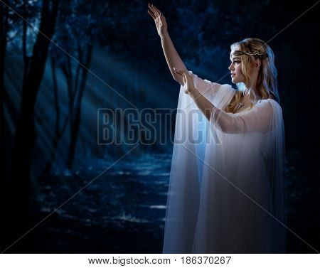 Elven girl in night forest
