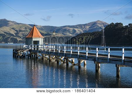 The landmark of Akaroa Daly's Wharf at sunset.